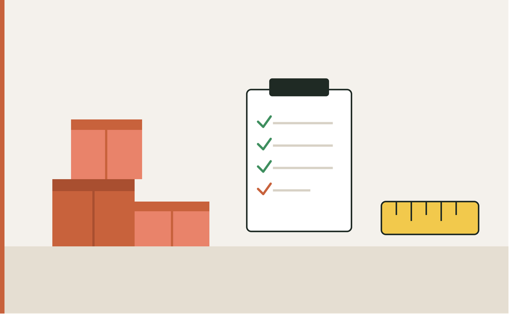 Inspector checking packed cartons against a checklist before shipment
